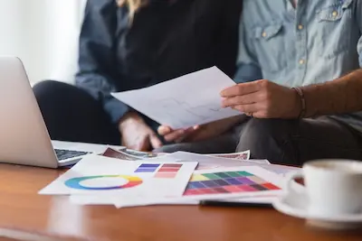 Brand team discussing campaign strategy in a modern office
