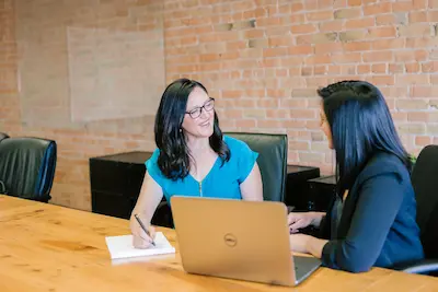 Professionals reviewing analytics on a laptop